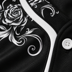 Close-up of the white baroque filigree print on the black jersey fabric