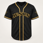 Black JESUS baseball jersey with gold braid trim, front view, JESUS arched in gold-outlined letters