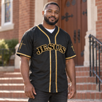 Man wearing the JESUS baseball jersey on church steps in the morning