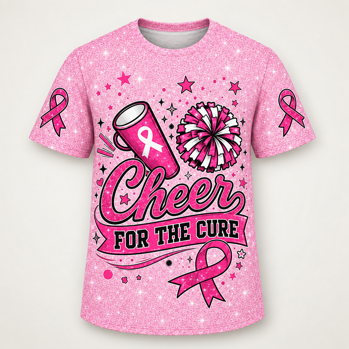 Pink sparkle t-shirt, front view, cheer megaphone and pom-pom above Cheer For The Cure with a pink ribbon