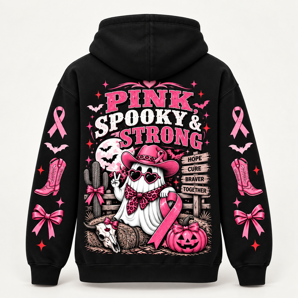 Back view reading Pink Spooky and Strong with a cowgirl ghost, hay bales and a Hope Cure Braver Together signpost