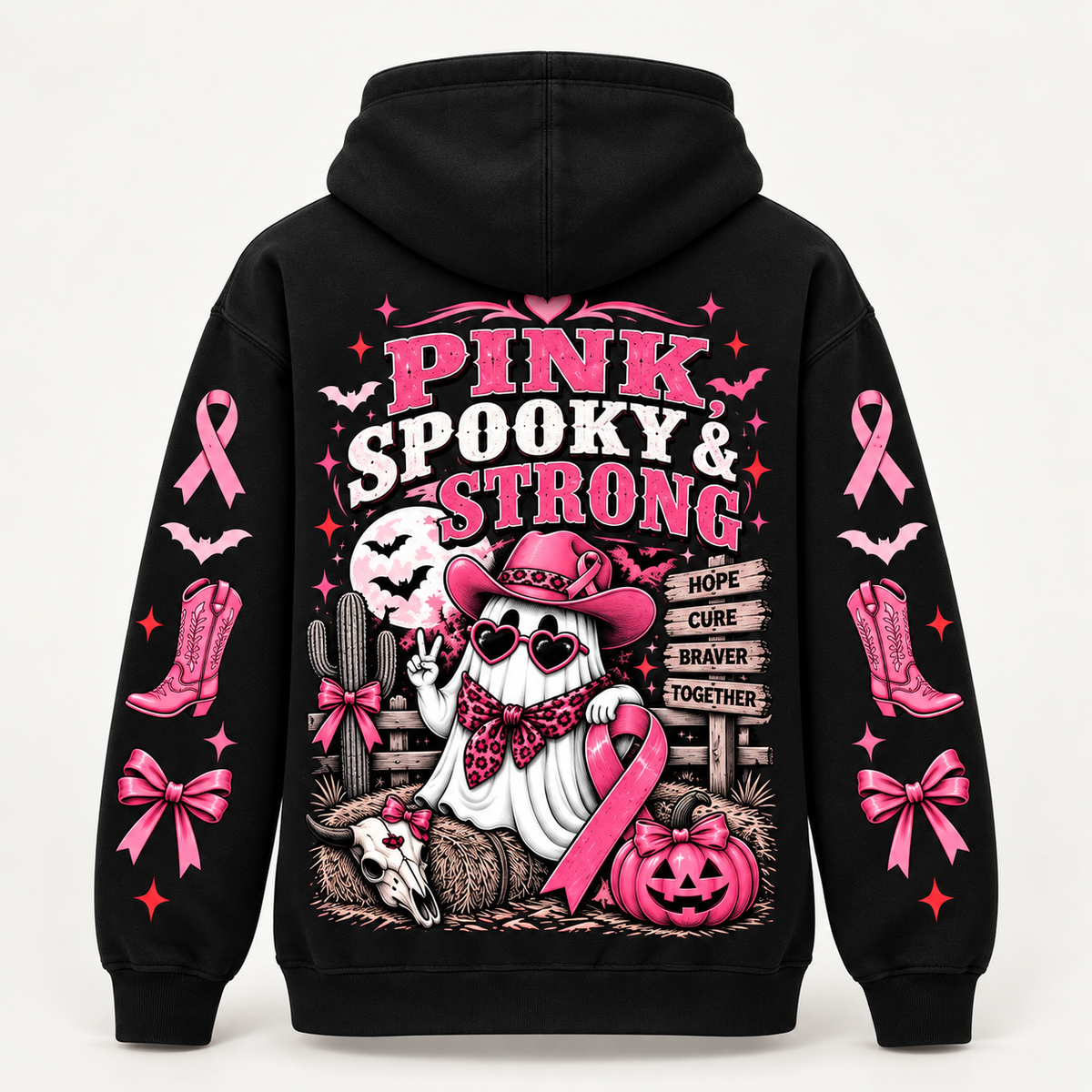 Back view reading Pink Spooky and Strong with a cowgirl ghost, hay bales and a Hope Cure Braver Together signpost