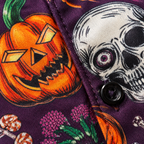 Close-up of the printed fabric and button on the Halloween Hawaiian shirt