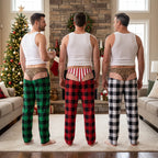 Three guys in matching funny underwear print pajama pants at Christmas