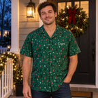 Man wearing the green Christmas tree Hawaiian shirt with Cooper on the chest