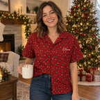 Woman wearing the red Christmas tree Hawaiian shirt with Olivia on the chest