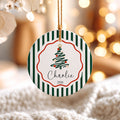 Green stripe ceramic Christmas ornament Charlie 2026 hanging by a gold cord
